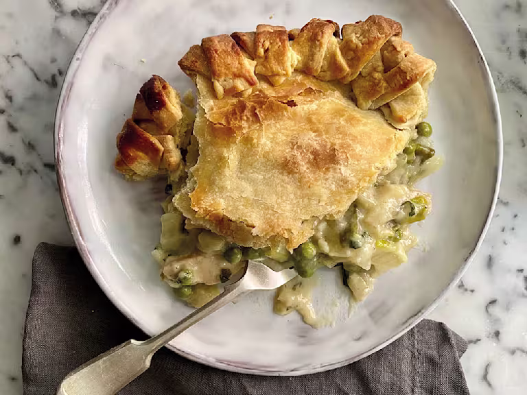 A generous serving of pie topped with shortcrust pastry and filled with Quorn Fillets, leeks, peas, and mint.