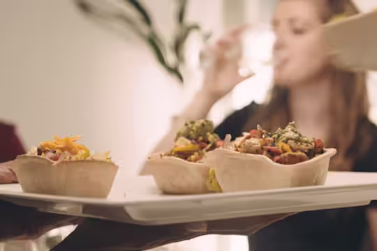 Meat free tacos recipe made with vegetarian Quorn Mince and diced vegetables served in a taco shell on a white platter