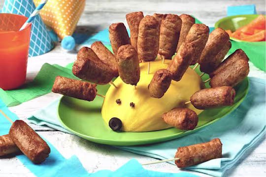 Quorn Vegetarian Cocktail Sausages with mango shaped like a hedgehog, served on a plate
