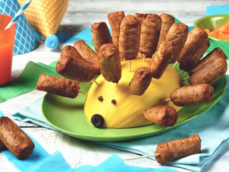 Quorn Vegetarian Cocktail Sausages with mango shaped like a hedgehog, served on a plate