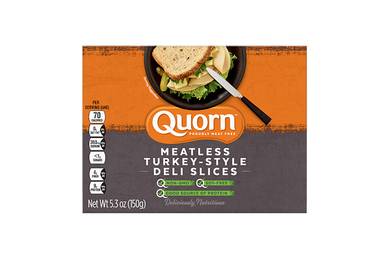 A box of Quorn Meatless Turkey Style Deli Slices showing the product and product information on an orange and charcoal background.