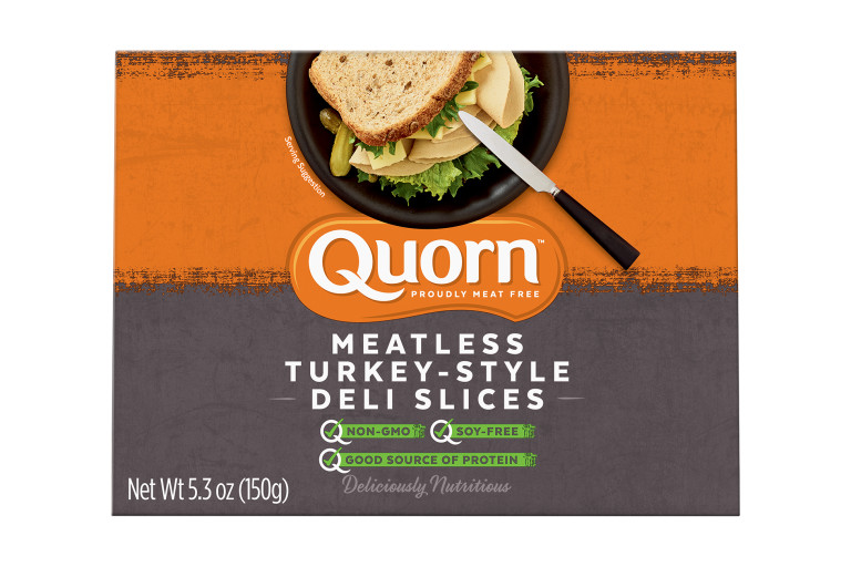 A box of Quorn Meatless Turkey Style Deli Slices showing the product and product information on an orange and charcoal background.