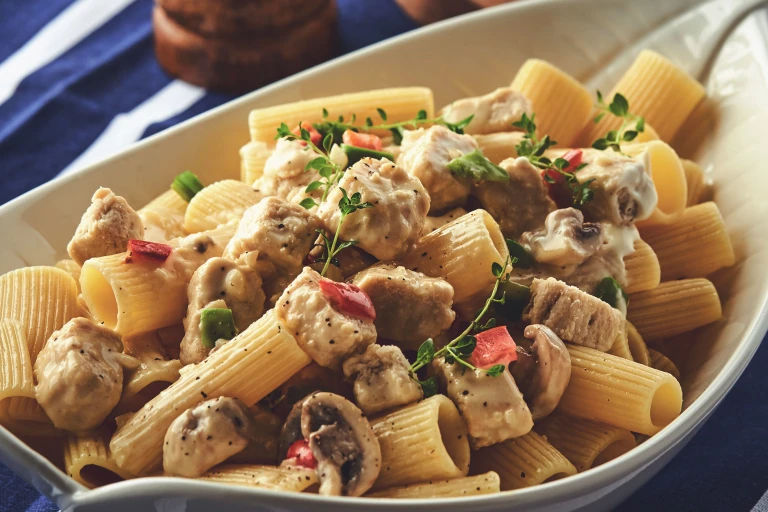 A close up of Quorn Meat-Free Pasta Alfredo served in a white dish.