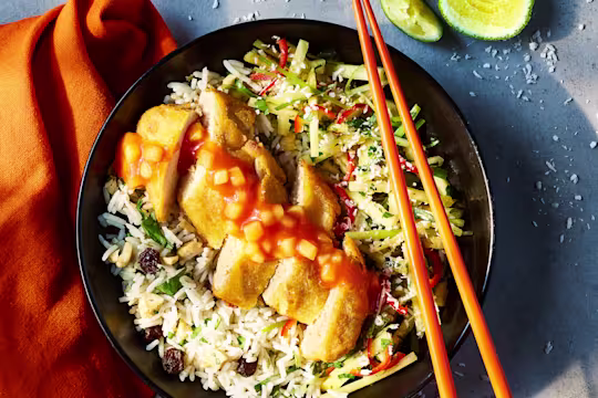 Sweer and sour Quorn Tempura Vegetarian Chicken fillets topped with a spring onion pineapple salsa sat on a bed of cashew rice.