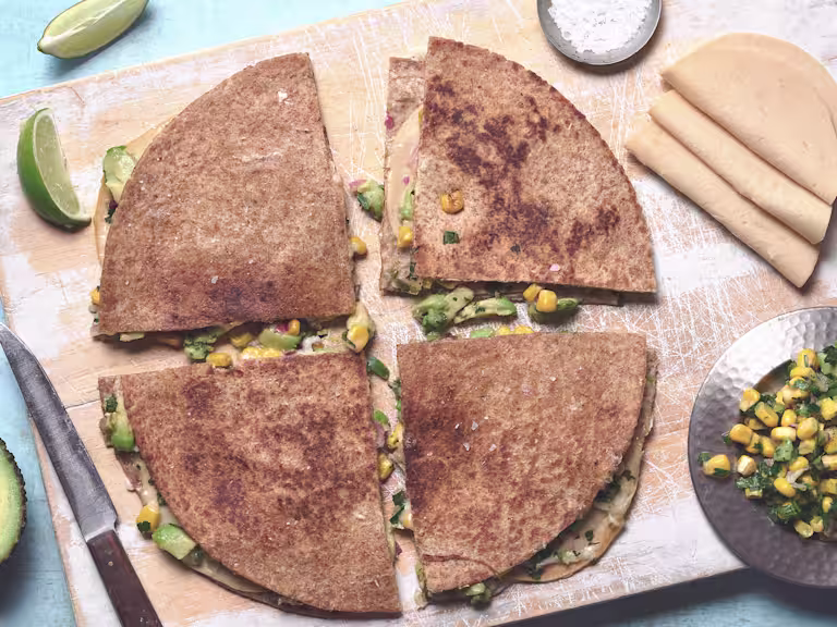 Vegetarian quesadilla of Quorn Vegan Chicken Free Slices, avocado and sweetcorn between tortilla wraps, cut into quarters