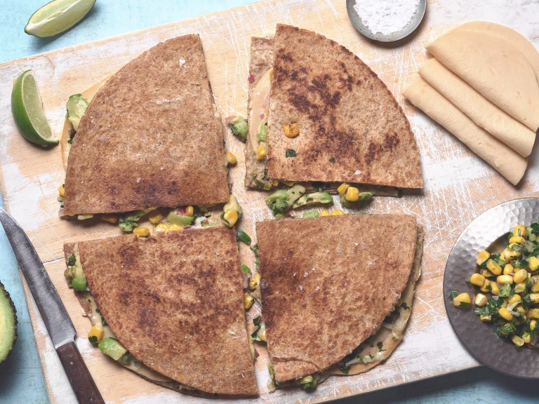 Vegetarian quesadilla of Quorn Vegan Chicken Free Slices, avocado and sweetcorn between tortilla wraps, cut into quarters