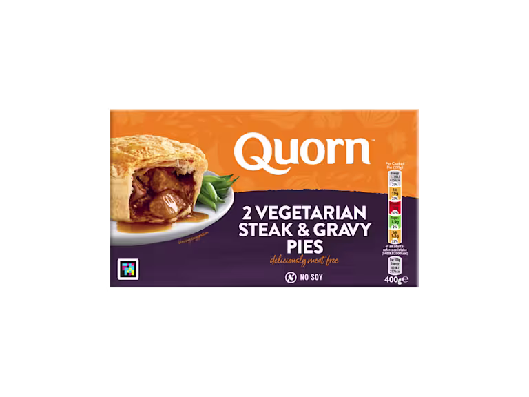 A box of Quorn Steak & Gravy Pies showing the prepared product and information on an orange and charcoal background.
