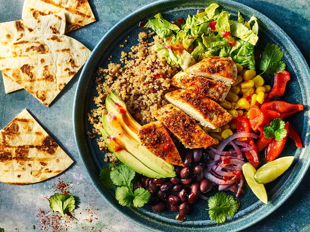 Vegetarian burrito bowl with Quorn fillets and salad.