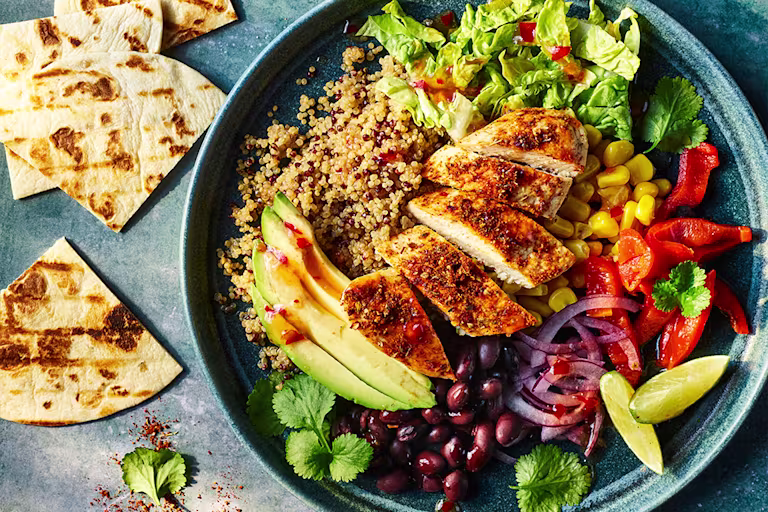 Vegetarian burrito bowl with Quorn fillets and salad.