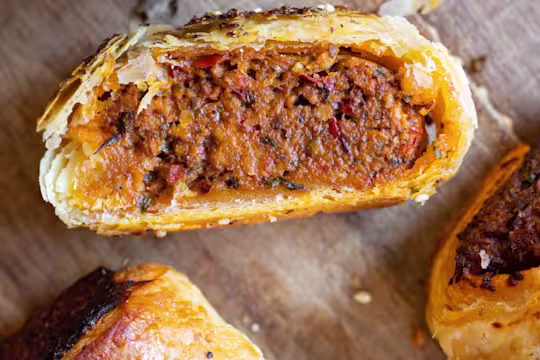 Harissa rolls cut in half to display the inside.