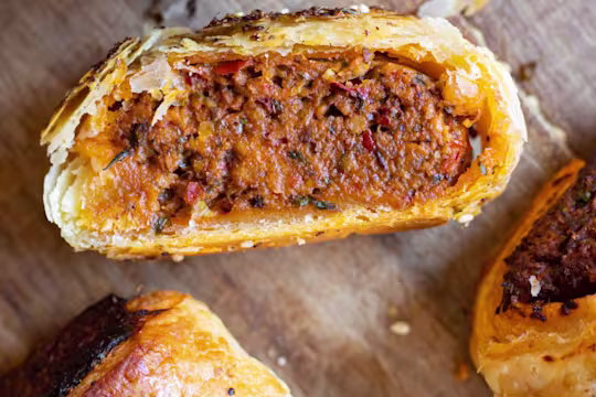 Harissa rolls cut in half to display the inside.