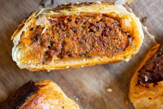 Harissa rolls cut in half to display the inside.