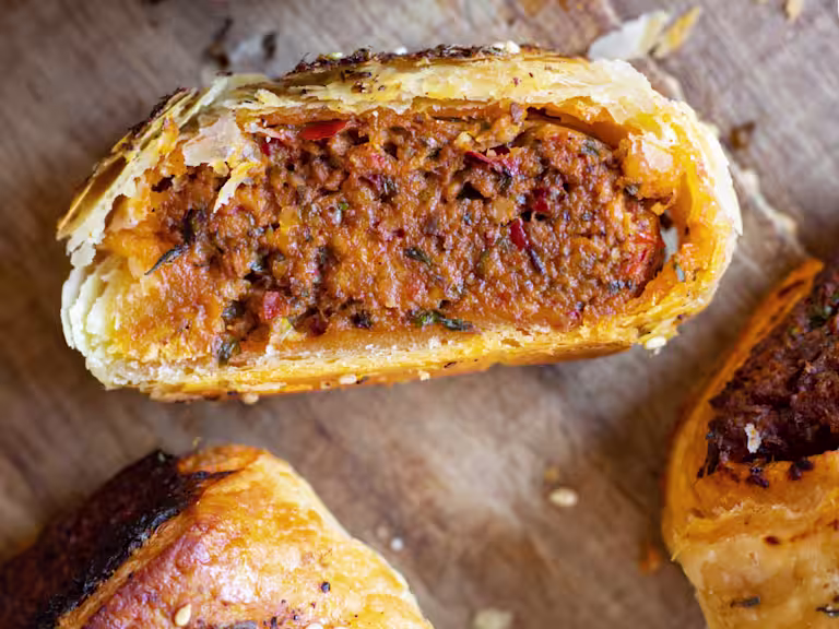 Harissa rolls cut in half to display the inside.