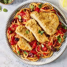 Close-up product image of the Quorn NEW Lemon & Pepper Schnitzels 220g pack, using the distinct split orange and teal packaging seen in other Quorn lines.