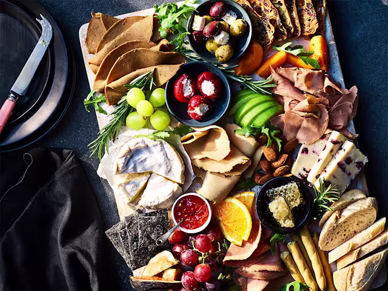 A grazing platter with a selection of Quorn vegan deli meats and other foods.