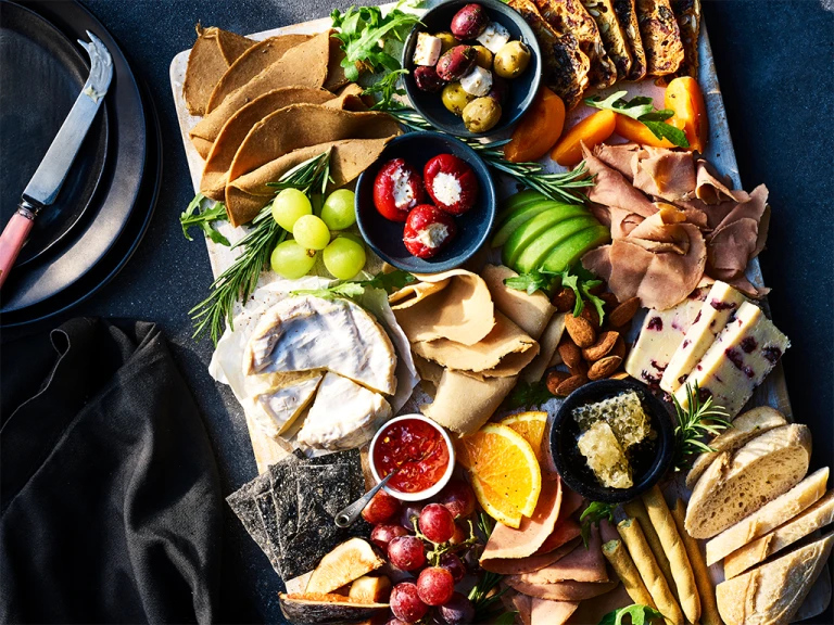 A grazing platter with a selection of Quorn vegan deli meats and other foods.