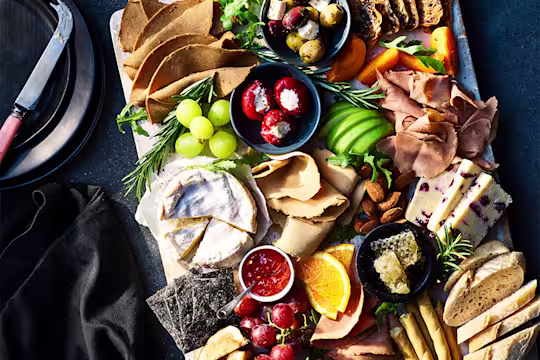 A grazing platter with a selection of Quorn deli meats and other foods.