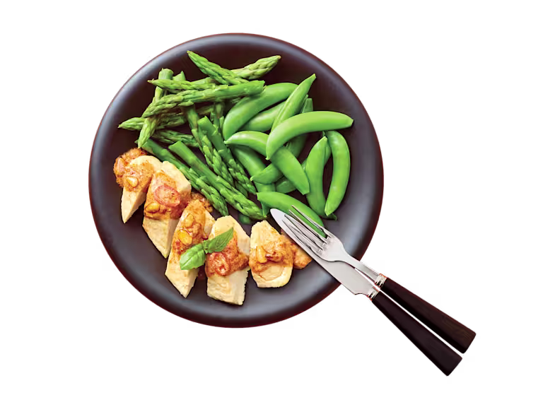 A bag of Quorn Fillets showing the prepared product and information on an orange and charcoal background.