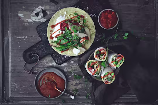 Easy vegetarian recipe made with Quorn Roast Mini Fillets served on top of a wrap next to bowls of sauce and finished wraps