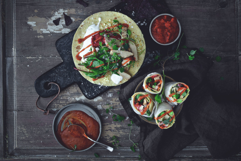 Easy vegetarian recipe made with Quorn Roasted Sliced Fillets served on top of a wrap next to bowls of sauce and finished wraps