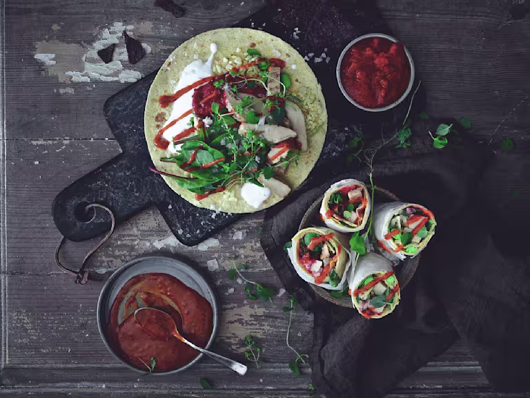 Easy vegetarian recipe made with Quorn Roast Mini Fillets served on top of a wrap next to bowls of sauce and finished wraps