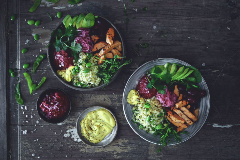 Salad bowl and plate with Quorn Roasted Sliced Fillets, bulgur, avocado, kidney beans, pickled onion and beetroot hummus
