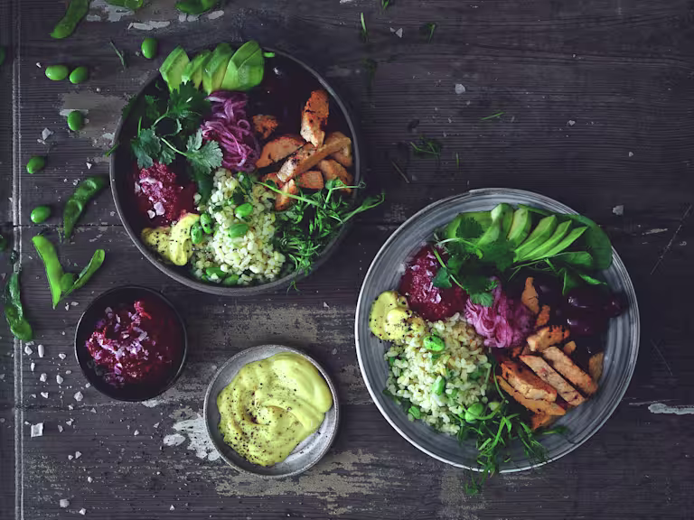 Salad bowl and plate with Quorn Roast Mini Fillets, bulgur, avocado, kidney beans, pickled onion and beetroot hummus