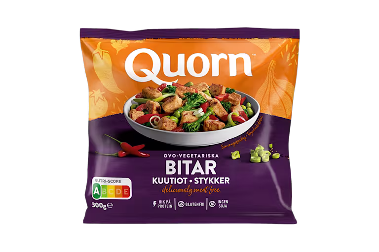 A bag of Quorn Pieces showing the prepared product and information on an orange and charcoal background.