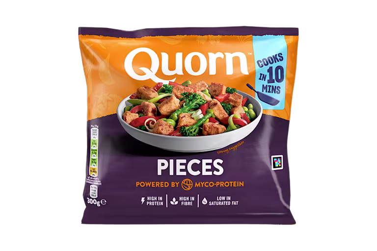 A bag of Quorn Pieces showing the prepared product and information on an orange and charcoal background.