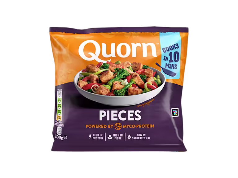 A bag of Quorn Pieces showing the prepared product and information on an orange and charcoal background.