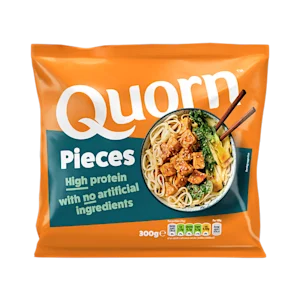 A bag of Quorn Pieces showing the prepared product and information on an orange and charcoal background.