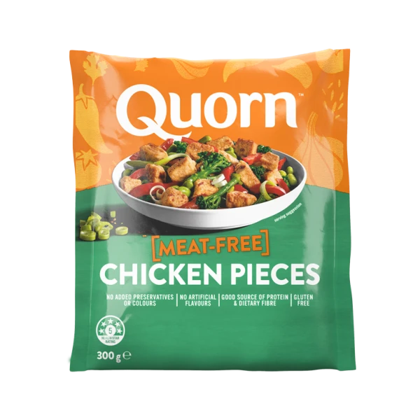 A bag of Quorn Pieces showing the prepared product and information on an orange and charcoal background.