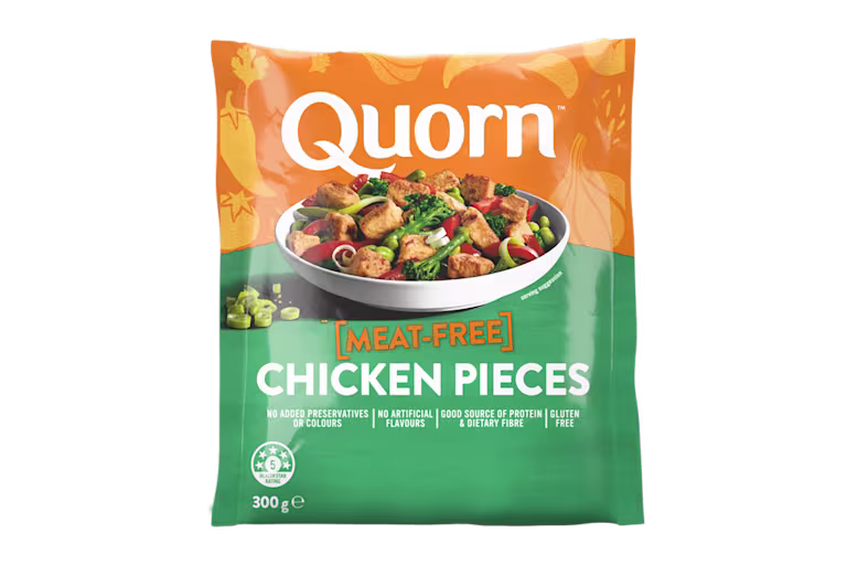 A bag of Quorn Pieces showing the prepared product and information on an orange and charcoal background.