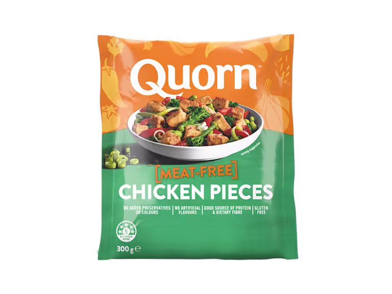 A bag of Quorn Pieces showing the prepared product and information on an orange and charcoal background.