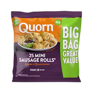 Quorn Vegan Mini Sausage Rolls on a baking tray next to a bowl of tomato ketchup.