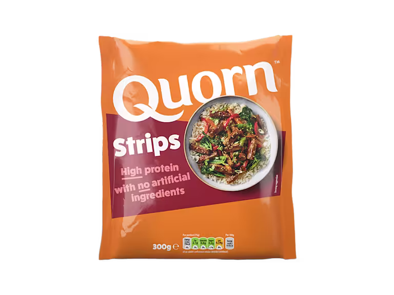 A packet of Quorn Vegetarian Steak Strips showing the plated product and information on an orange and charcoal background.