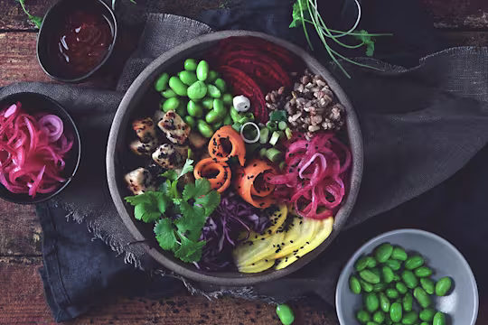A meat free, veggie bowl made with Quorn Pieces, edamame beans, picked onions, sliced carrot, beetroot, radish and grains