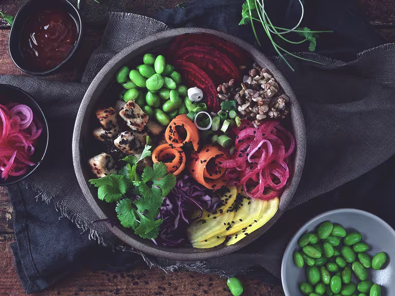 A meat free, veggie bowl made with Quorn Pieces, edamame beans, picked onions, sliced carrot, beetroot, radish and grains