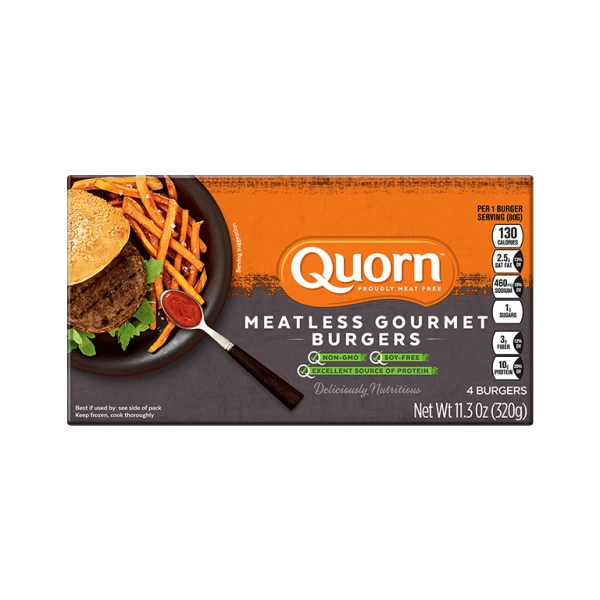A box of Quorn Meatless Gourmet Burgers showing the product and the product information on an orange and charcoal background.