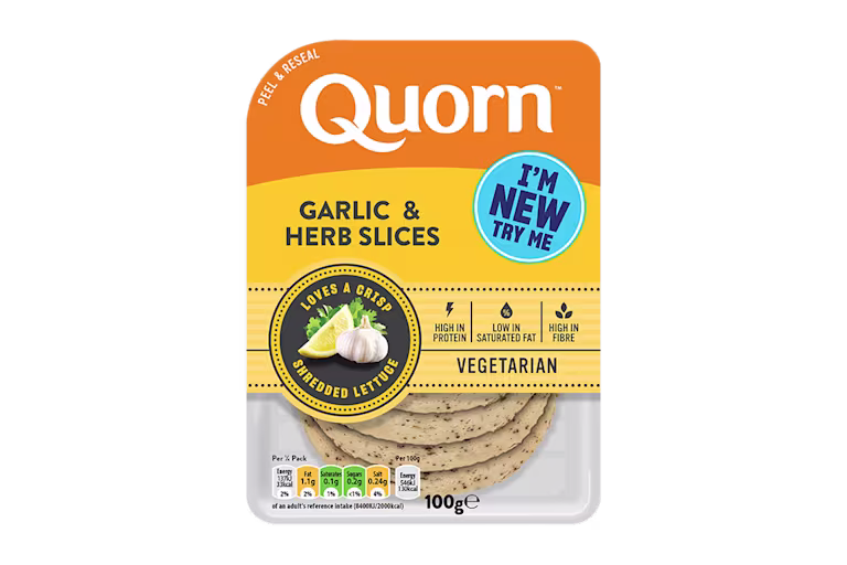 Orange Quorn Garlic & Herb Slices peel and reseal packaging, with a blue new product label and serving suggestion of lemon, shredded lettuce and garlic.