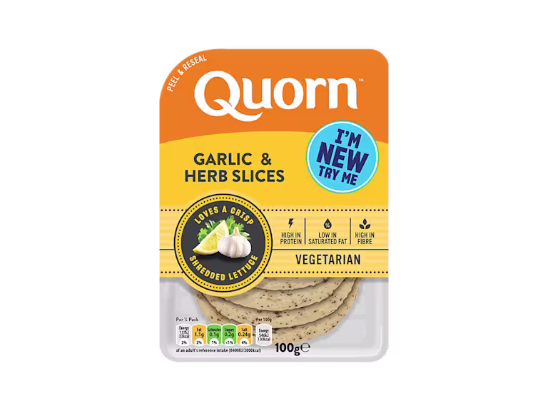 Orange Quorn Garlic & Herb Slices peel and reseal packaging, with a blue new product label and serving suggestion of lemon, shredded lettuce and garlic.