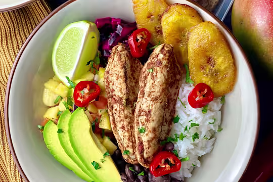 Quorn Fajita Mini Fillet poke bowl served topped with red chillies and served in a white bowl