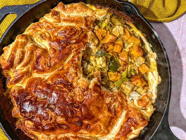 Creamy Korma Quorn Pieces, Leek and Caramelised Butternut Squash pie served in a skillet dish.