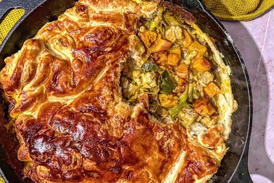 Creamy Korma Quorn Pieces, Leek and Caramelised Butternut Squash pie served in a skillet dish.