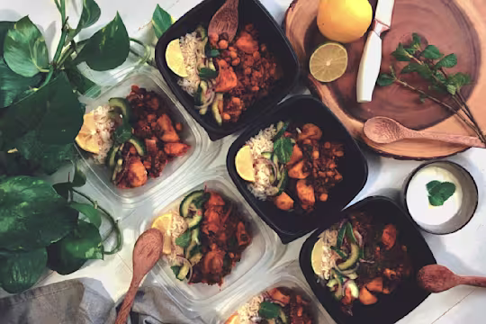 Vegetarian Curry Hot Pot, made with Quorn Mince, sweet potatoes, chickpeas, spinach, lime, beans and onion, served in bowls.