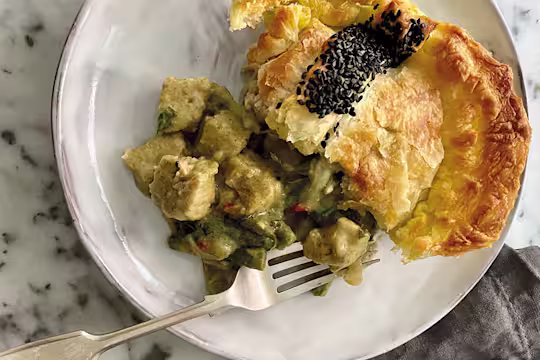 A generous serving of a puff pastry pie filled with Quorn Vegan Pieces and vegetables in a Thai green curry sauce.