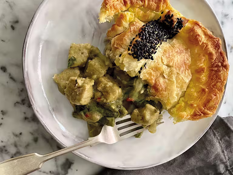 A generous serving of a puff pastry pie filled with Quorn Vegan Pieces and vegetables in a Thai green curry sauce.