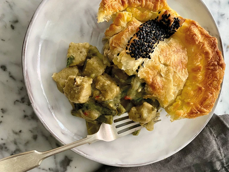 A generous serving of a puff pastry pie filled with Quorn Pieces and vegetables in a Thai green curry sauce.