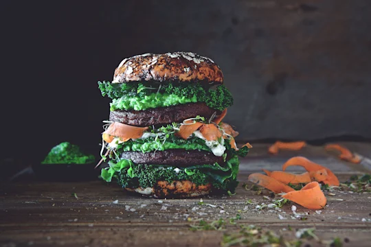 Quorn Ultimate Vegetarian Green Burger with shavings of carrots by the side.