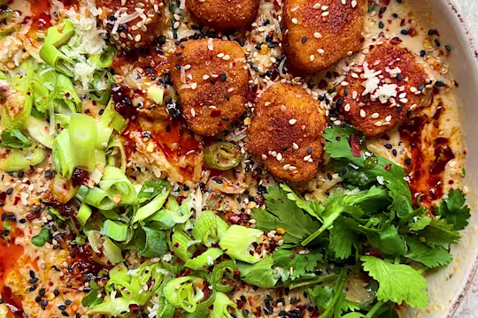 Coated Quorn Nuggets in ramen broth with spring onion and coriander garnish